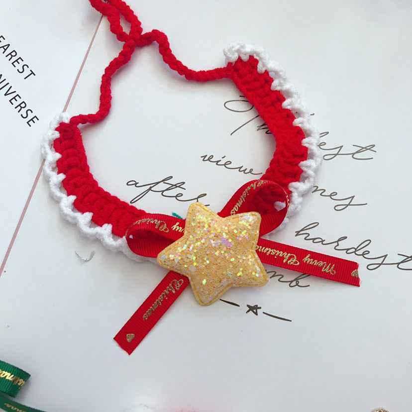Red wool pet collar with white trim and glitter star charm. Handmade Christmas accessory with festive ribbon for pets.