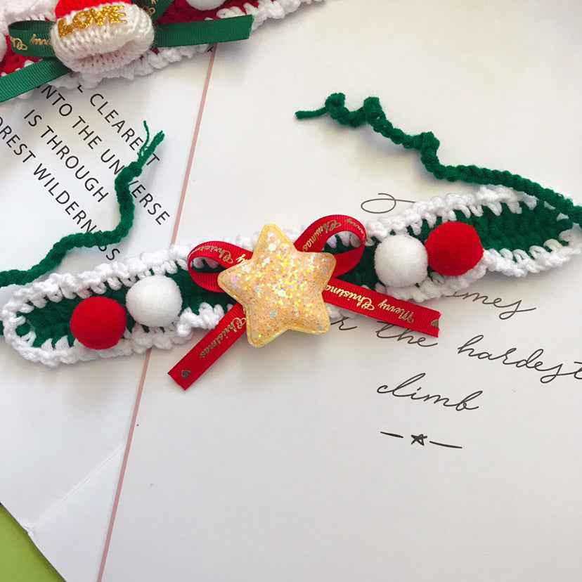 Crocheted wool pet collar with red, white, and green pom-poms and glitter star. Christmas-themed handmade accessory for pets.