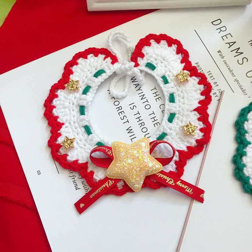 Hand-woven wool pet collar in red and white with gold stars and glitter star charm. Festive Christmas accessory for pets.